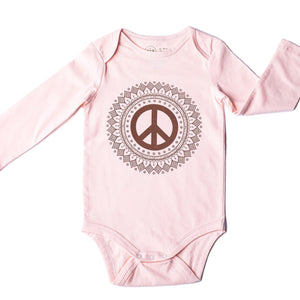 Pink long sleeve baby onesie with peace sign print