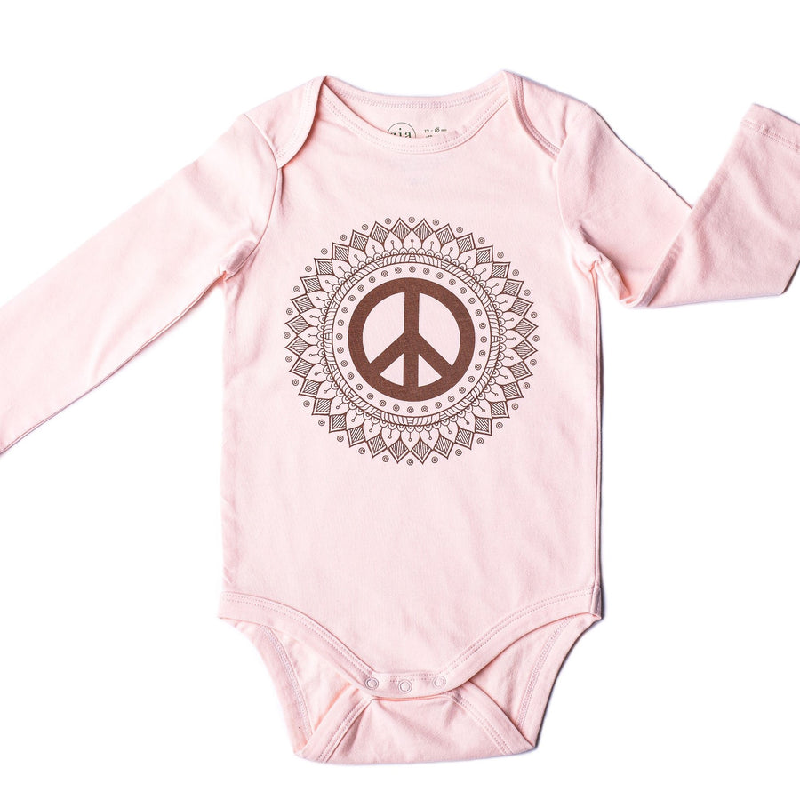 Pink long sleeve baby onesie with peace sign print