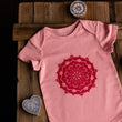 Load image into Gallery viewer, Pink short sleeve baby onesie with mandala print on wooden background
