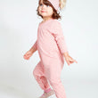 Load image into Gallery viewer, Baby girl wearing a pink long sleeve one piece with leaf print