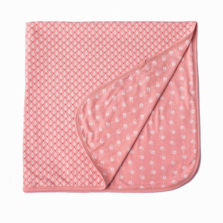 Pink baby girl blanket with heart and leaf print by Zia NYC
