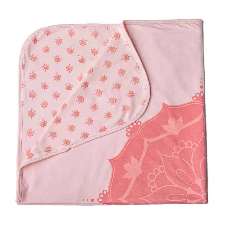 Pink baby blanket with mandala print on one side and lotus flower print on the other