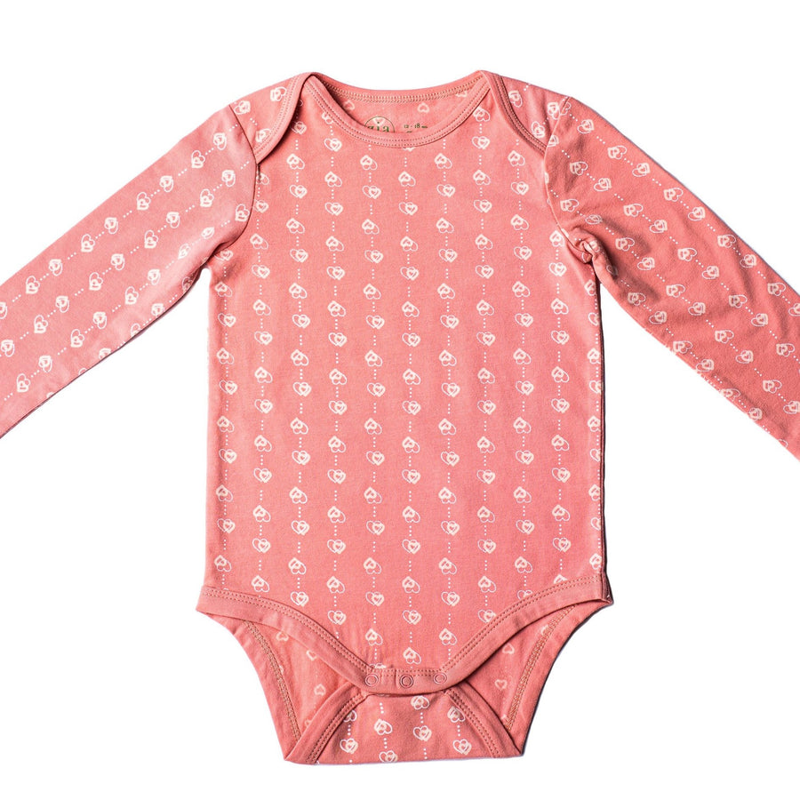Pink long sleeve baby onesie with heart print
