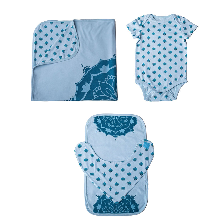 Baby essentials set with blue baby blanket with mandala and lotus flower print, short sleeve onesie with lotus flower print, burp cloth and bib