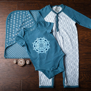 Blue baby blanket, short sleeve onesie, and blue baby romper with diamond print